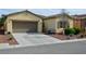 Inviting single-story home with an attached garage, desert landscaping and cozy front bench at 4770 Lorenzo Way, Pahrump, NV 89061