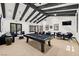 Stylish game room featuring a pool table, comfortable seating, and contemporary decor at 4770 Lorenzo Way, Pahrump, NV 89061