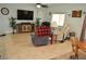 Spacious living room with hardwood floors, neutral paint, and comfortable seating at 4770 Lorenzo Way, Pahrump, NV 89061