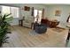 Spacious living room with hardwood floors, neutral paint, and comfortable seating at 4770 Lorenzo Way, Pahrump, NV 89061