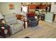 Comfortable living room with tile floors open to the kitchen and dining area, perfect for entertaining at 4770 Lorenzo Way, Pahrump, NV 89061