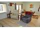 Bright living room with wood floors, with a dining area visible in the background at 4770 Lorenzo Way, Pahrump, NV 89061