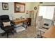 Home office features dual workstations, wood floors, and a light green color scheme at 4770 Lorenzo Way, Pahrump, NV 89061