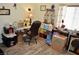 Cluttered craft room features a desk, storage shelves, and vinyl wood-style floors at 4770 Lorenzo Way, Pahrump, NV 89061