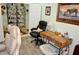 Cozy home office featuring a desk, comfortable chairs, and shelving for storage at 4770 Lorenzo Way, Pahrump, NV 89061
