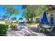 Community patio area featuring garden landscaping and table seating under umbrellas at 4770 Lorenzo Way, Pahrump, NV 89061