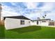 Expansive backyard featuring a well-maintained lawn and the square footage of the casita and main house at 4957 E Harmon Ave, Las Vegas, NV 89121