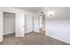 Bedroom with a view to the closet, neutral carpet, and fresh white paint at 4957 E Harmon Ave, Las Vegas, NV 89121