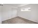 Bright bedroom with neutral carpet, white walls, and minimalist design at 4957 E Harmon Ave, Las Vegas, NV 89121