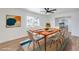 Bright dining room with modern furniture and a view of the neighborhood at 4957 E Harmon Ave, Las Vegas, NV 89121