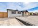 Well-maintained single-story home featuring a xeriscaped front yard and convenient driveway at 4957 E Harmon Ave, Las Vegas, NV 89121