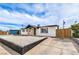 Well-maintained exterior featuring a xeriscaped front yard, fresh paint, and modern design elements at 4957 E Harmon Ave, Las Vegas, NV 89121