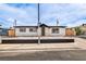 Charming single-story home with a xeriscaped front yard and modern wood slat accents at 4957 E Harmon Ave, Las Vegas, NV 89121