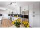 Modern kitchen featuring stainless steel appliances, sleek white cabinets, and stylish backsplash at 4957 E Harmon Ave, Las Vegas, NV 89121