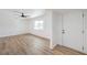 Bright living room showcasing new wood-look flooring and a modern ceiling fan at 4957 E Harmon Ave, Las Vegas, NV 89121