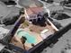 Stunning aerial view of a home with a sparkling pool and a well-maintained backyard at 504 Landra Ln, Henderson, NV 89015