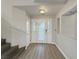 Spacious entryway with light flooring, a staircase, and a decorative front door for a warm welcome at 504 Landra Ln, Henderson, NV 89015