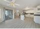 Open concept living space with kitchen, island and access to outdoor patio at 504 Landra Ln, Henderson, NV 89015