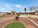 Beautiful backyard featuring a swimming pool, desert landscaping, and privacy fencing at 504 Landra Ln, Henderson, NV 89015