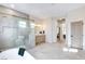 Spacious primary bathroom featuring marble floors, a glass shower, and a modern vanity at 5737 Heather Breeze Ct, Las Vegas, NV 89141