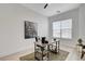 Home office featuring a modern desk, a black chair, and a large window for natural light at 5737 Heather Breeze Ct, Las Vegas, NV 89141