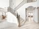 Open staircase with wrought iron railings and wood steps leading to the upper level at 5737 Heather Breeze Ct, Las Vegas, NV 89141