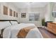 Bright bedroom featuring a queen bed, window with view, and modern décor at 5751 E Hacienda Ave # 119, Las Vegas, NV 89122
