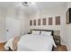 Comfortable bedroom featuring a queen bed with white bedding and neutral decor at 5751 E Hacienda Ave # 119, Las Vegas, NV 89122