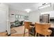 Open kitchen with stainless appliances and granite countertops, next to a workspace at 5751 E Hacienda Ave # 119, Las Vegas, NV 89122