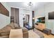 Comfortable living room with a brown sofa and sliding glass doors to a balcony area with seating at 5751 E Hacienda Ave # 119, Las Vegas, NV 89122