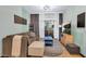 Inviting living room with a brown sofa, modern decor, and balcony access for relaxation at 5751 E Hacienda Ave # 119, Las Vegas, NV 89122