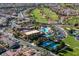 Community aerial view shows pool, tennis courts, golf course and tree-lined streets with beautiful homes at 580 Via Di Parione Ct, Henderson, NV 89011