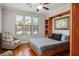 Cozy bedroom with hardwood floors, murphy bed, recessed lights, and three windows providing natural light at 580 Via Di Parione Ct, Henderson, NV 89011
