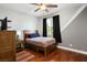 Bright bedroom featuring hardwood floors, ample natural light, and contemporary design at 580 Via Di Parione Ct, Henderson, NV 89011