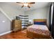 Bedroom featuring hardwood floors, ample natural light, dresser and modern design at 580 Via Di Parione Ct, Henderson, NV 89011