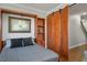 Bedroom with murphy bed, hardwood floors, recessed lighting and open shelving at 580 Via Di Parione Ct, Henderson, NV 89011