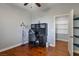 Cozy bedroom with wood floors, including a desk setup and a walk-in closet for storage at 580 Via Di Parione Ct, Henderson, NV 89011