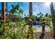 Resort-style community pool with palm trees and waterfall feature at 580 Via Di Parione Ct, Henderson, NV 89011