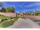 Tuscany Village and Golf entrance featuring stone signage, landscaping and a beautiful entryway at 580 Via Di Parione Ct, Henderson, NV 89011