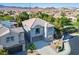 Charming two-story home featuring a tile roof, balcony, and a well-manicured front yard in a tranquil neighborhood at 580 Via Di Parione Ct, Henderson, NV 89011