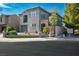Two-story home features a muted stucco facade, stone accents, a manicured lawn, and an attached two-car garage at 580 Via Di Parione Ct, Henderson, NV 89011