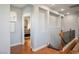 A bright hallway boasts hardwood floors, recessed lighting, decorative insets, and a stairway to the next level at 580 Via Di Parione Ct, Henderson, NV 89011