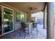 Covered outdoor patio features a built-in kitchen and bar seating at 580 Via Di Parione Ct, Henderson, NV 89011