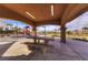 Outdoor picnic area with playground featuring a table and benches, perfect for Gathering gatherings at 580 Via Di Parione Ct, Henderson, NV 89011
