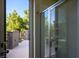An glass-enclosed shower provides natural light and beautiful backyard views on the outdoor balcony at 580 Via Di Parione Ct, Henderson, NV 89011