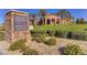 Community signage with directions to Avellino, La Luna, Model Homes, Golf Course and La Piazza at 580 Via Di Parione Ct, Henderson, NV 89011