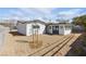 Home with a spacious backyard featuring a well-maintained yard and modern architecture, perfect for outdoor enjoyment at 613 Kings Pl, Boulder City, NV 89005