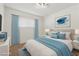 Cozy bedroom featuring soft blue accents, plush bedding, and a bright, airy atmosphere at 613 Kings Pl, Boulder City, NV 89005
