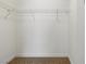 Walk-in closet features wire shelving and neutral carpet for easy organization and storage at 613 Kings Pl, Boulder City, NV 89005