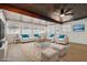 Spacious living room with coffered ceiling, ceiling fan, lots of natural light and comfortable seating at 613 Kings Pl, Boulder City, NV 89005